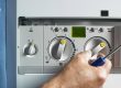 engineer fixing lpg boiler