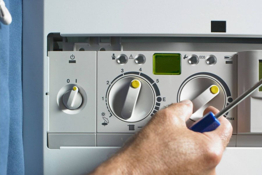 engineer fixing lpg boiler